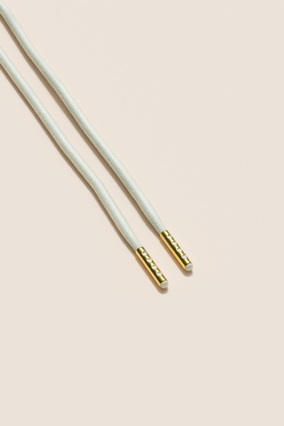 Senkels Offwhite 4mm Runde voksede skolisser med Gull-dupper
